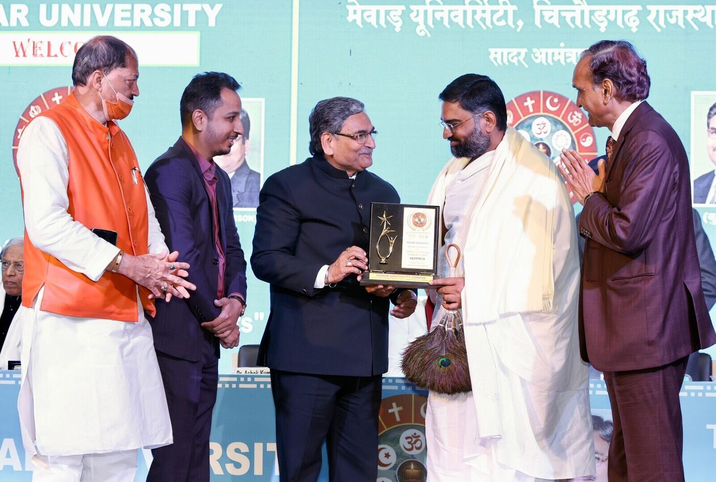Yog Bhooshan Maharaj receiving award from Mewar University Chittorgarh — Efforts to Eradicate Religious Doubts